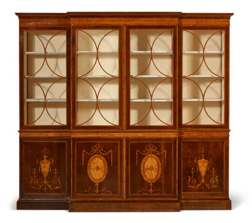 A GEORGE III EBONY AND BOXWOOD STRUNG HAREWOOD, SYCAMORE AND TULIPWOOD MARQUETRY BREAKFRONT BOOKCASE - photo 1