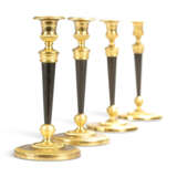 A SET OF FOUR EMPIRE ORMOLU AND PATINATED-BRONZE CANDLESTICKS - фото 1