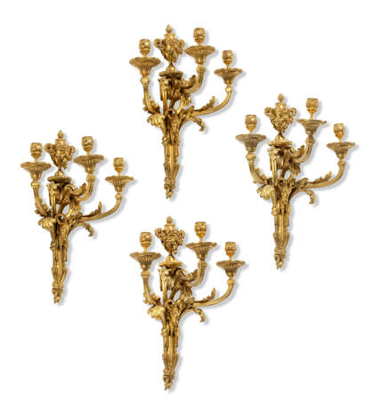 A SET OF FOUR FRENCH ORMOLU THREE-BRANCH WALL-LIGHTS - photo 1
