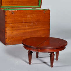 AN EDWARDIAN MAHOGANY DEMONSTRATION MODEL OF A `JUPE'-STYLE EXTENDING DINING-TABLE