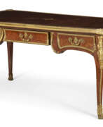 Parquetage. A FRENCH ORMOLU-MOUNTED TULIPWOOD AND PARQUETRY BUREAU PLAT