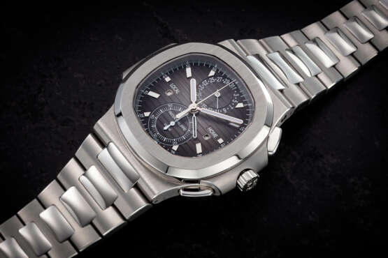 PATEK PHILIPPE, REF. 5990/1A, A FINE STEEL AUTOMATIC DUAL TIME FLYBACK CHRONOGRAPH - photo 1
