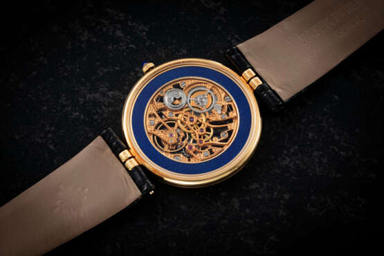 PATEK PHILIPPE, REF. 3885, AN ATTRACTIVE GOLD SKELETONIZED ENAMEL DIAL WRISTWATCH - фото 2