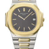 PATEK PHILIPPE. A VERY RARE 18K GOLD AND STAINLESS STEEL AUTOMATIC WRISTWATCH WITH DATE AND BRACELET - photo 1