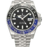 ROLEX. A STAINLESS STEEL AUTOMATIC DUAL TIME WRISTWATCH WITH SWEEP CENTRE SECONDS, DATE AND BRACELET - photo 1