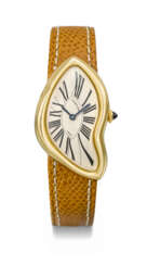 CARTIER. A VERY RARE AND UNUSUAL 18K GOLD LIMITED EDITION ASYMMETRICAL WRISTWATCH WITH ‘CRASH’ DEPLOYANT CLASP