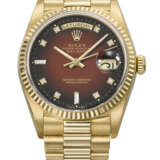ROLEX. A RARE AND ATTRACTIVE 18K GOLD AND DIAMOND-SET AUTOMATIC WRISTWATCH WITH SWEEP CENTRE SECONDS, DAY, DATE, RED VIGNETTE DIAL AND BRACELET - photo 1