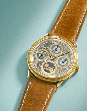 AUDEMARS PIGUET. A RARE AND ELEGANT 18K GOLD AUTOMATIC SKELETONIZED PERPETUAL CALENDAR WRISTWATCH WITH MOON PHASES - Foto 2