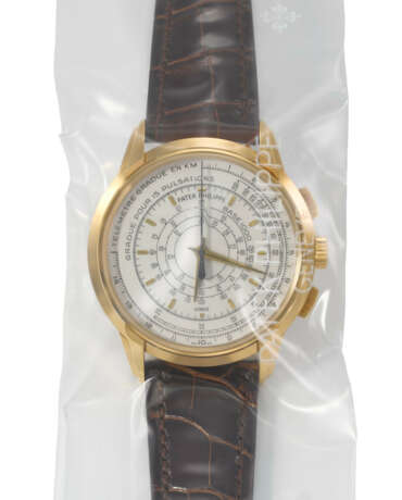 PATEK PHILIPPE. A RARE 18K GOLD LIMITED EDITION AUTOMATIC MULTI-SCALE CHRONOGRAPH WRISTWATCH, MADE TO COMMEMORATE THE 175TH ANNIVERSARY OF PATEK PHILIPPE IN 2014 - Foto 1