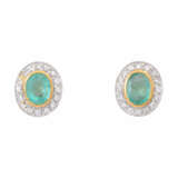 Stud earrings with oval emeralds entouraged by diamonds total ca. 0,3 ct, - фото 1