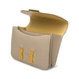 A LIMITED EDITION ARGILE & TABAC CAMEL SWIFT LEATHER VERSO MINI CONSTANCE 18 WITH JAUNE ENAMEL & GOLD HARDWARE - фото 6