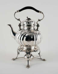 Large teapot with twisted features on rechaud