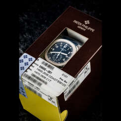 PATEK PHILIPPE. AN 18K WHITE GOLD AUTOMATIC FLYBACK CHRONOGRAPH WRISTWATCH WITH DATE, DOUBLE SEALED