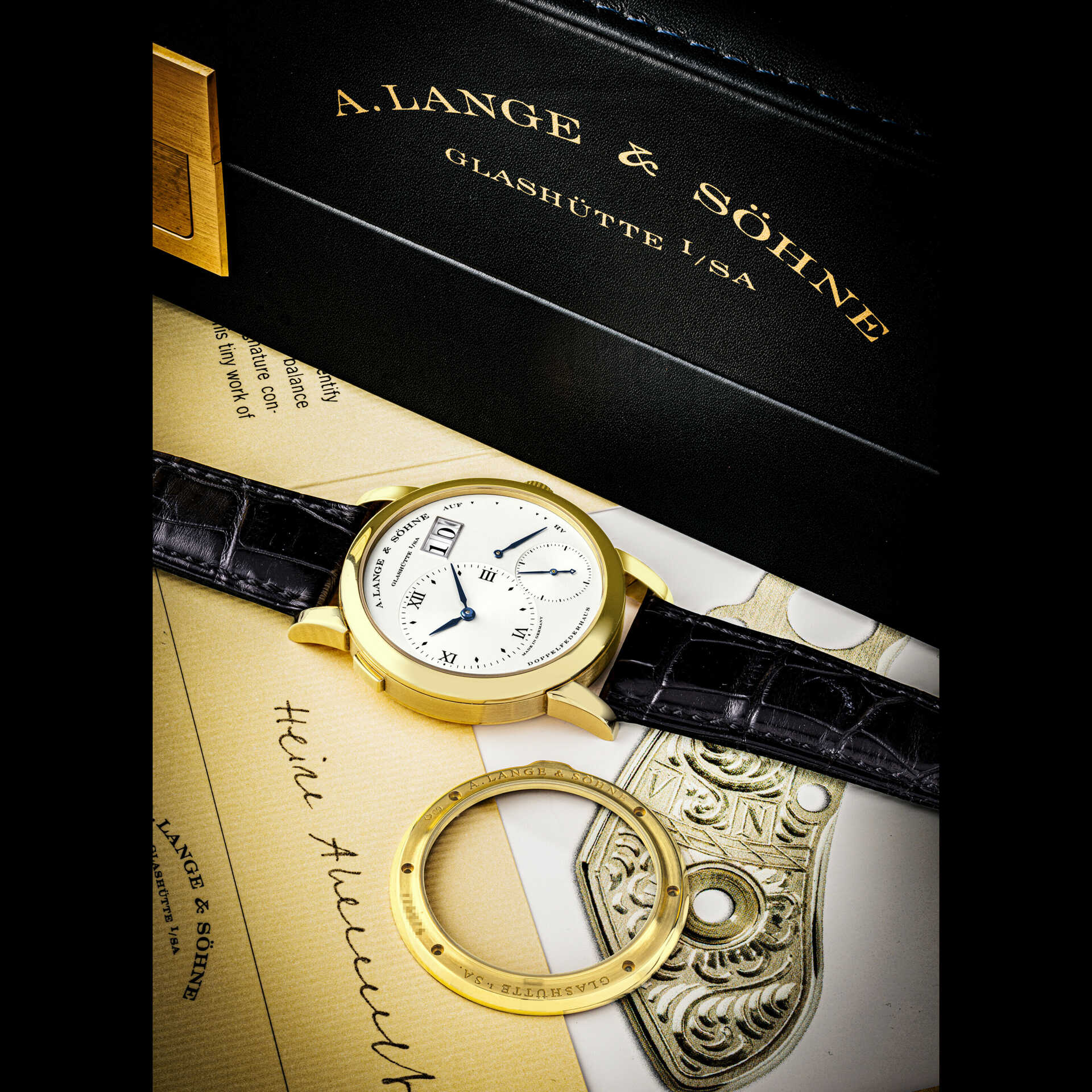 A. LANGE &amp; S&#214;HNE. AN EXTREMELY EARLY, RARE AND IMPORTANT 18K GOLD WRISTWATCH WITH OVERSIZED DATE, POWER RESERVE INDICATOR, BLUED HANDS AND ADDITIONAL SAPPHIRE CRYSTAL CASE BACK