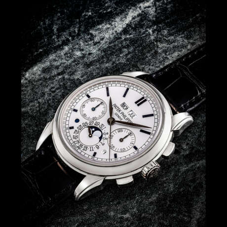 PATEK PHILIPPE. AN 18K WHITE GOLD PERPETUAL CALENDAR CHRONOGRAPH WRISTWATCH WITH MOON PHASES, LEAP YEAR AND DAY/NIGHT INDICATION - photo 1