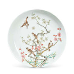 A VERY RARE AND FINE FAMILLE ROSE BLACK-BACK &#39;FLOWERS AND BIRDS’ DISH