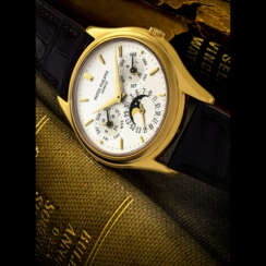 PATEK PHILIPPE. A RARE 18K GOLD AUTOMATIC PERPETUAL CALENDAR WRISTWATCH WITH MOON PHASES, 24 HOUR AND LEAP YEAR INDICATION