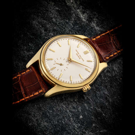 PATEK PHILIPPE. AN 18K GOLD AUTOMATIC WRISTWATCH WITH ENAMEL DIAL - photo 1