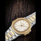 PATEK PHILIPPE. A STAINLESS STEEL AND 18K GOLD AUTOMATIC WRISTWATCH WITH SWEEP CENTRE SECONDS, DATE AND BRACELET - photo 1