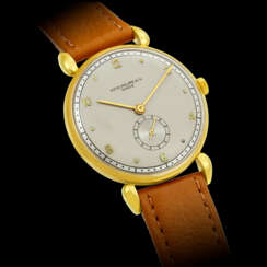 PATEK PHILIPPE. AN 18K GOLD WRISTWATCH WITH TWO TONE DIAL