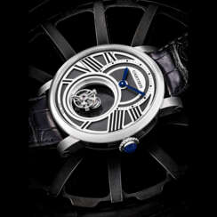 CARTIER. A VERY FINE PLATINUM MYSTERIOUS TOURBILLON WRISTWATCH