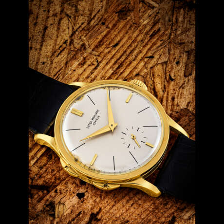 PATEK PHILIPPE. A VERY RARE 18K GOLD WRISTWATCH WITH ADJUSTABLE HOUR HAND - photo 1