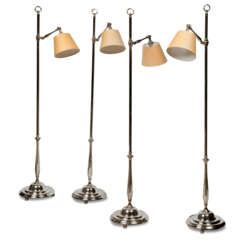 A SET OF FOUR SILVERED-BRASS &#39;WINCHESTER&#39; STANDARD LAMPS
