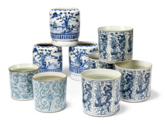 A GROUP OF NINE CHINESE BLUE AND WHITE CYLINDRICAL VESSELS