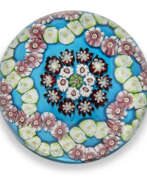 Baccarat Glasshouse. A CLICHY PATTERNED MILLEFIORI COLOUR-GROUND WEIGHT