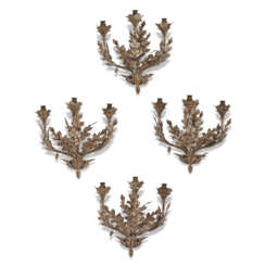 A SET OF FOUR TOLE PEINTE THREE-BRANCH WALL-LIGHTS
