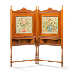 A LATE VICTORIAN ARTS AND CRAFTS WALNUT AND EMBROIDERY TWO-PANELLED SCREEN