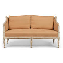 A NORTH EUROPEAN PARCEL-GILT AND WHITE-PAINTED CARVED WOOD AND COMPOSITION SOFA
