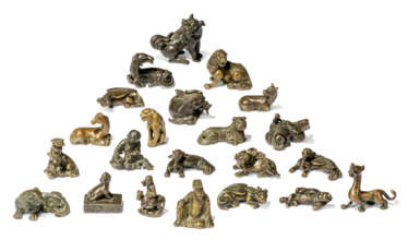 A COLLECTION OF TWENTY-TWO CHINESE BRONZE SCROLL WEIGHTS