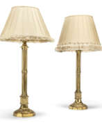 Neogotika. A PAIR OF GOTHIC REVIVAL GILT-BRASS TABLE LAMPS
