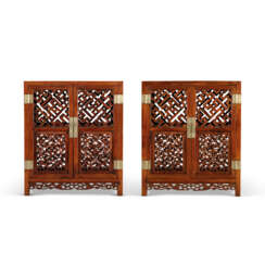 A PAIR OF HUANGHUALI CABINETS WITH LATTICED PANELS