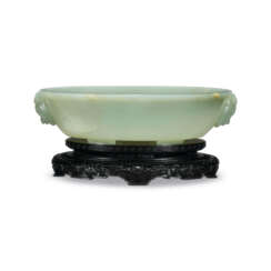 A LARGE CELADON JADE WASHER