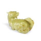 A VERY RARE LARGE YELLOW JADE CARVING OF A XIEZHI - photo 2