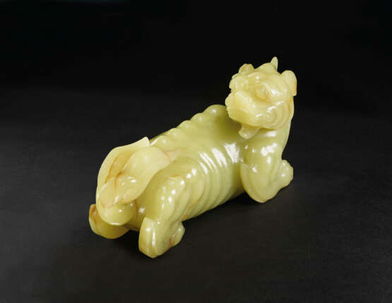 A VERY RARE LARGE YELLOW JADE CARVING OF A XIEZHI - photo 4