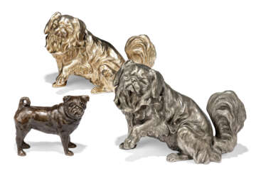 TWO SILVERED-METAL MODELS OF PEKINESE DOGS