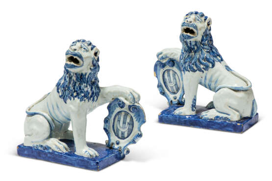 A PAIR OF DUTCH DELFT BLUE AND WHITE ARMORIAL MODELS OF LIONS - photo 1