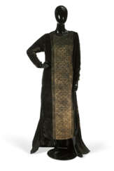 A BLACK SILK VELVET AND PLEATED SILK EVENING GOWN