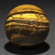 A LARGE SPHERE OF BANDED IRON TIGER EYE - Аукционные цены