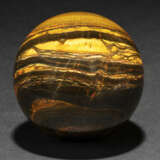 A LARGE SPHERE OF BANDED IRON TIGER EYE - Foto 1