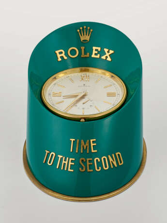 ROLEX, GILT BRASS AND PAINTED HOOF-SHAPED DISPLAY DESK CLOCK 'TIME TO THE SECOND' WITH STOP FEATURE - Foto 1