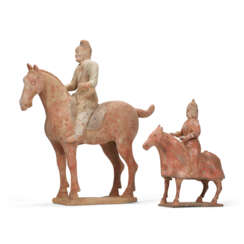 TWO PAINTED POTTERY FIGURES OF HORSES AND RIDERS
