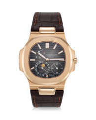 PATEK PHILIPPE, REF. 5712R-001 SIGNED AND RETAILED BY TIFFANY &amp; CO., NAUTILUS, A RARE 18K ROSE GOLD WRISTWATCH WITH POWER RESERVE, MOON PHASES, AND DATE