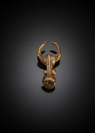 Bronzeanhänger in Form eines Büffelkopfes - Foto 1