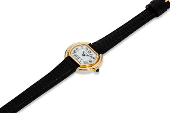 CARTIER, ELLIPSE “MINI,” A FINE 18K YELLOW GOLD OVAL-SHAPED WRISTWATCH - фото 2