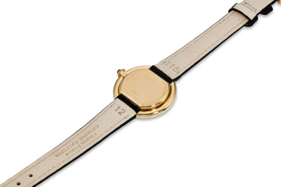 CARTIER, ELLIPSE “MINI,” A FINE 18K YELLOW GOLD OVAL-SHAPED WRISTWATCH - фото 3