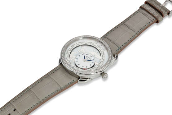 HERMÈS, REF. AR10.530, ARCEAU LE TEMPS VOYAGEUR, A FINE STEEL AND DIAMOND-SET WORLD TIME WRISTWATCH WITH ROTATING MOTHER-OF-PEARL DISPLAY - photo 2